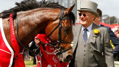  Owner Lloyd Williams celebrates in the mounting yard after winning race 7, the Emirates Melbourne Cup with his horse Rekindling in 2017