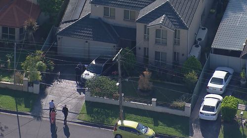 Police officers at the property in Wentworthville.