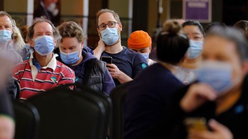 Photo of medical staff and patients at the Royal Exhibition Building Vaccination Hub on Saturday 31 July 2021.