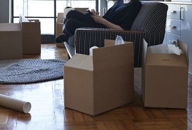 Woman packing up apartment ahead of move