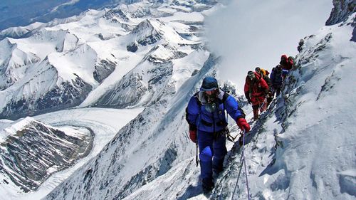 Takao Arayama, in blue jacket, pictured just 200 metres from the summit of the Mount Everest. Arayama was aged 70 years, 7 months and 13 days when he reached the top.