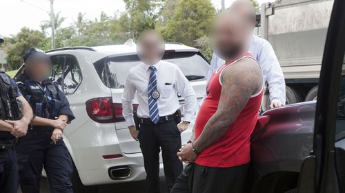 Police will allege the man and two women, also charged, laundered proceeds of crime through a number of businesses and property assets. (Queensland Police)