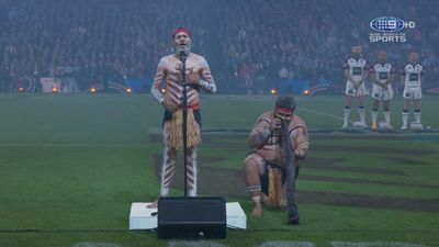 Indigenous leader Ashley Ruska performs a welcome to country to begin the pre-match formalities.