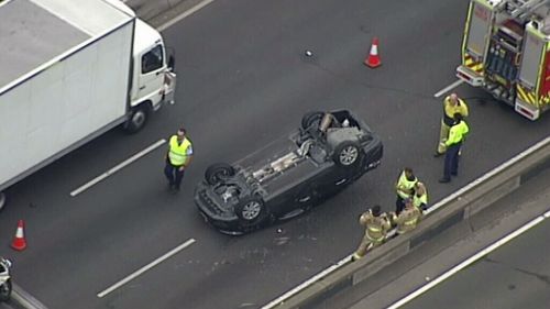 Significant delays on Sydney’s M4 at Clyde after car flips onto roof during crash