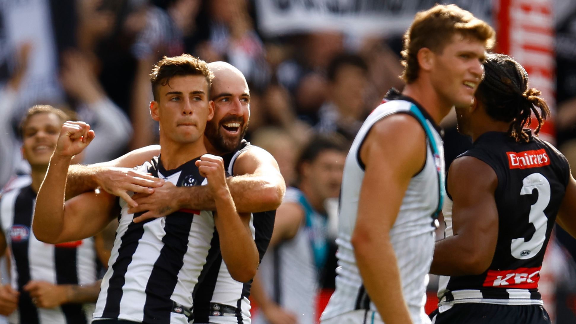 MELBOURNE, AUSTRALIA - MARCH 25: Nick Daicos (left) and Steele Sidebottom of the Magpies celebrate during the 2023 AFL Round 02 match between the Collingwood Magpies and the Port Adelaide Power at the Melbourne Cricket Ground on March 25, 2023 in Melbourne, Australia. (Photo by Michael Willson/AFL Photos)