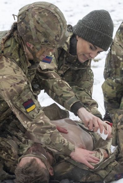 Kate,  Princess of Wales, Colonel, Irish Guards, is shown how to carry out battlefield casualty drills to deliver care to injured soldiers during a casualty simulation exercise, during her first visit to the 1st Battalion Irish Guards since becoming Colonel, at the Salisbury Plain Training Area in Wiltshire, England, Wednesday March 8, 2023 