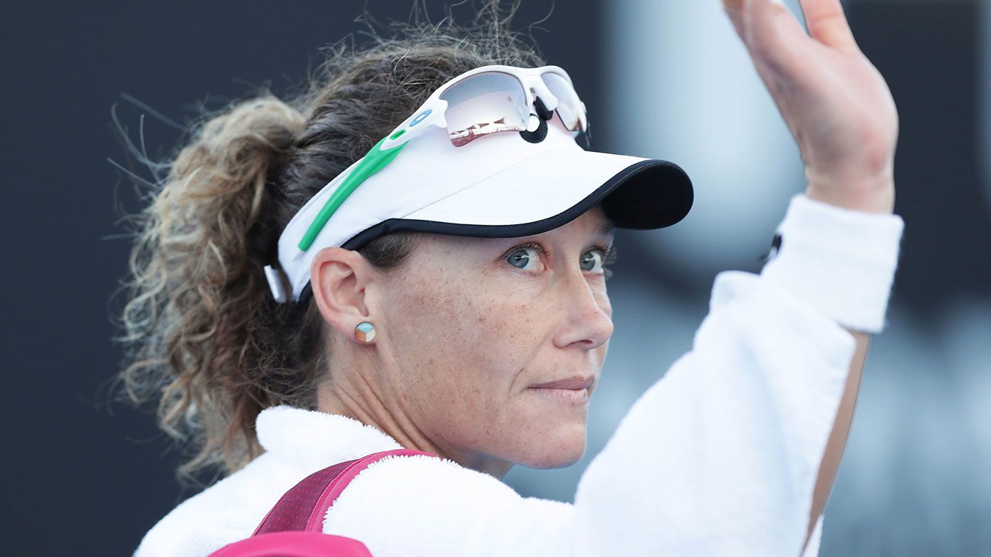 Samantha Stosur of Australia waves to the crowd after losing her first round singles match against Veronika Kudermetova of Russia