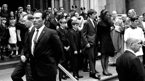 Robert Jnr escorts Ethel Kennedy escorted by her son Robert Jr after her her husband's funeral service.