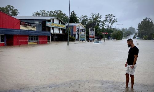 Omid Mehrzadi outside his flooded Oxley business. February 26, 2022