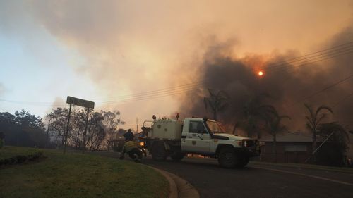 Smoke plunged the small town into darkness as the smell lingered in the air.