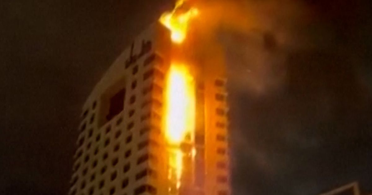 Fire tears through tower amid 'wave of hostile drones'