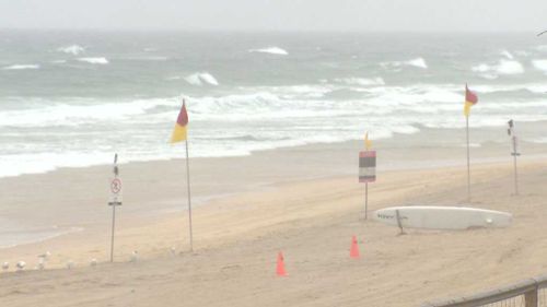 Surfers Paradise Beach is abandoned this morning with another 30mm of rain is forecast for southeast Queensland today. (9NEWS)