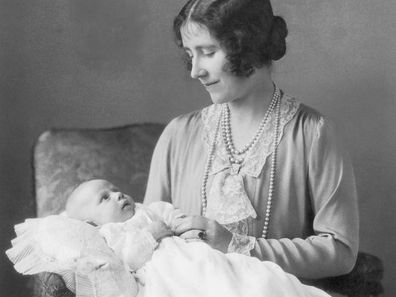 Elizabeth, the Queen Mother, holding her younger daughter Margaret Rose (1930 - 2002). 