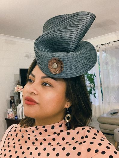 Woman fashions fascinator from $5 Kmart placemat for Melbourne Cup day.