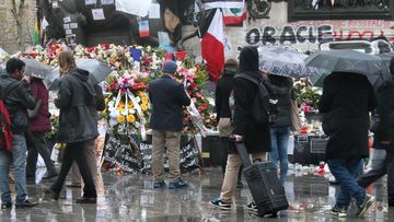 People visit the Place de la Republique to offer flowers to mourn the victims of the Paris terror attacks in November last year. (AAP)