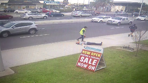 The man in the shorts appears to run from the scene after the alleged assault on Springvale Road.