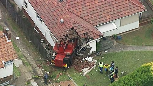 A crane has crahsed into a house in Pendle Hill. (9NEWS)