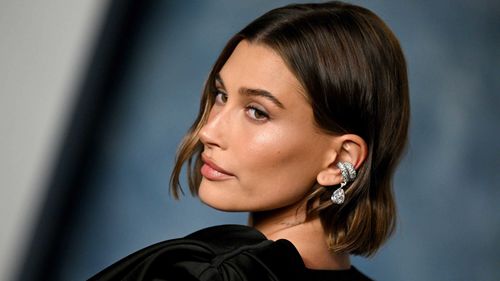 Hailey Bieber attends the Vanity Fair Oscar Party in Beverly Hills, California, on March 12. Bieber's beauty brand rhode sold to budget makeup powerhouse e.l.f. Beauty for $1 billion on May 28.