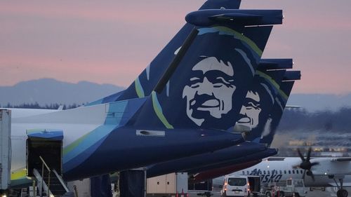 An Alaska Airlines flight made an emergency landing in Oregon on Friday after a window and chunk of its fuselage blew out in mid-air, media reports said.