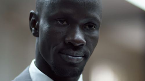 Mr Adut was conscripted into a rebel army and taken to Ethiopia, where he was shot in the back at the age of 12. (Western Sydney University)