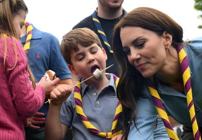 Prince Louis of Wales and Catherine, Princess of Wales toast marshmallows as they take part in the Big Help Out, during a visit to the 3rd Upton Scouts Hut in Slough on May 8, 2023