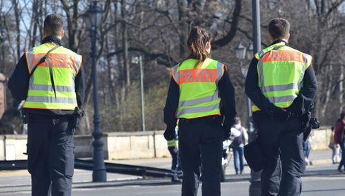 Police patrol the streets during the half-marathon run. (AP)