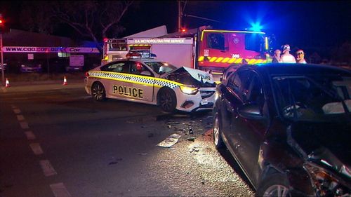 Two police officers and another driver have all been taken to hospital after a head-on smash in Adelaide's north-west.