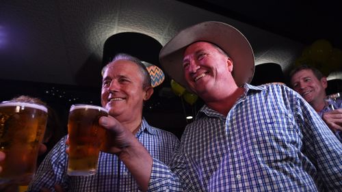 Barnaby Joyce and Prime Minister Malcolm Turnbull celebrate with a beer at The Nationals Party at West Tamworth Leagues Club in Tamworth. (AAP)