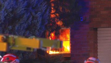 A fire has torn through a home in Ambarvale, Sydney.