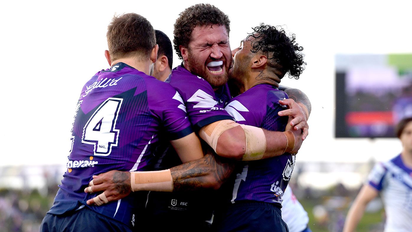 Kenny Bromwich of the Storm celebrates scoring a try 