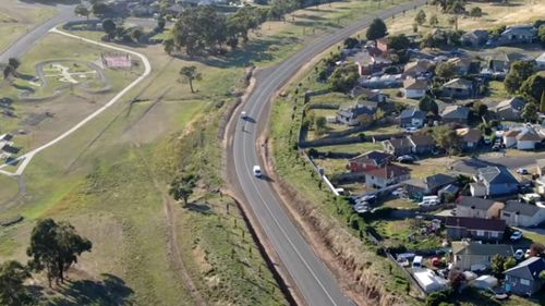 Drones are being used to find stolen vehicles and assist road safety. In this photo, a Tasmania Police drone tracks vehicles on a road. 