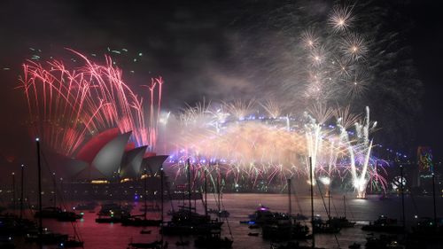 Fireworks explode over the Sydney Harbour during New Year's Eve celebrations in Sydney. (AAP)