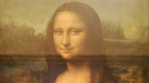 The famous Leonardo Da Vinci painting ' The Mona Lisa' is seen on display in the Grande Galerie of the Louvre museum on August 24, 2005 in Paris, France.