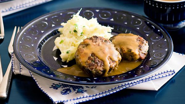 Beef and bacon rissoles with gravy and cabbage mash