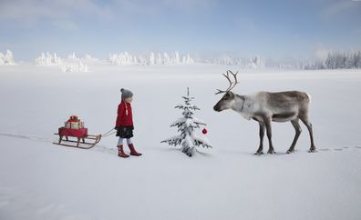 Child with reindeer