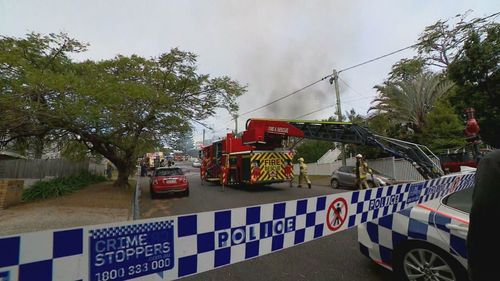 A monster fire that tore through three homes in Brisbane has left three people in hospital, including two firefighters. Residents of Evelyn Street at The Grange were on edge for hours as the flames spread and crews battled to save neighbouring properties