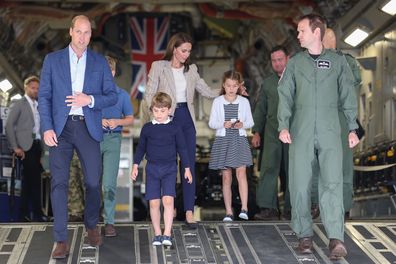FAIRFORD, ENGLAND - JULY 14: Prince William, Prince of Wales and Catherine, Princess of Wales with Prince George of Wales, Princess Charlotte of Wales and Prince Louis of Wales (C) as they walk down the ramp of a C17 plane during their visit to the Air Tattoo at RAF Fairford on July 14, 2023 in Fairford, England. The Prince and Princess of Wales have a strong relationship with the RAF, with the Prince having served with the Search and Rescue Force for over three years, based at RAF Valley in Ang