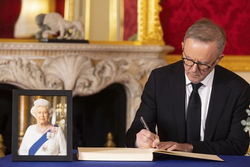Prime Minister of Australia Anthony Albanese signs a book of condolence to late Queen Elizabeth II at Lancaster House in London.