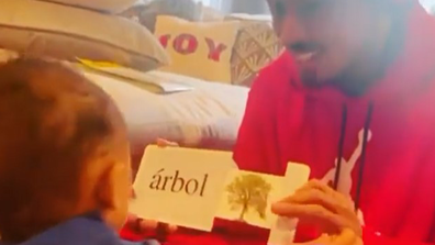 Nick Cannon uses flash cards to test his baby Powerful Queen on her reading skills