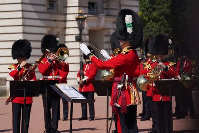 The Welsh Guards Band led by Band Major, Major Petritz-Watts, the first female leader of the guards band, perform 'Sweet Caroline' and 'Waltzing Matilda' at Buckingham Palace London, during the FIFA Women's World Cup semi-final between Australia and England.