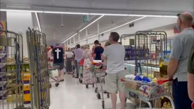 Scenes of panic buying have returned to supermarkets across Brisbane. 