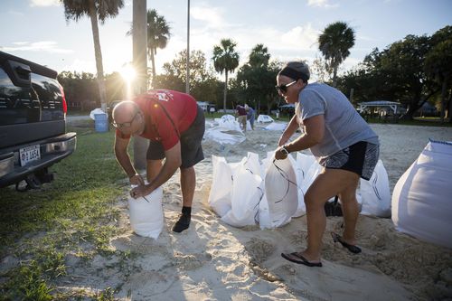 Sib McLellan, left, and his wife, Lisa, prepare for Hurricane Florence. 