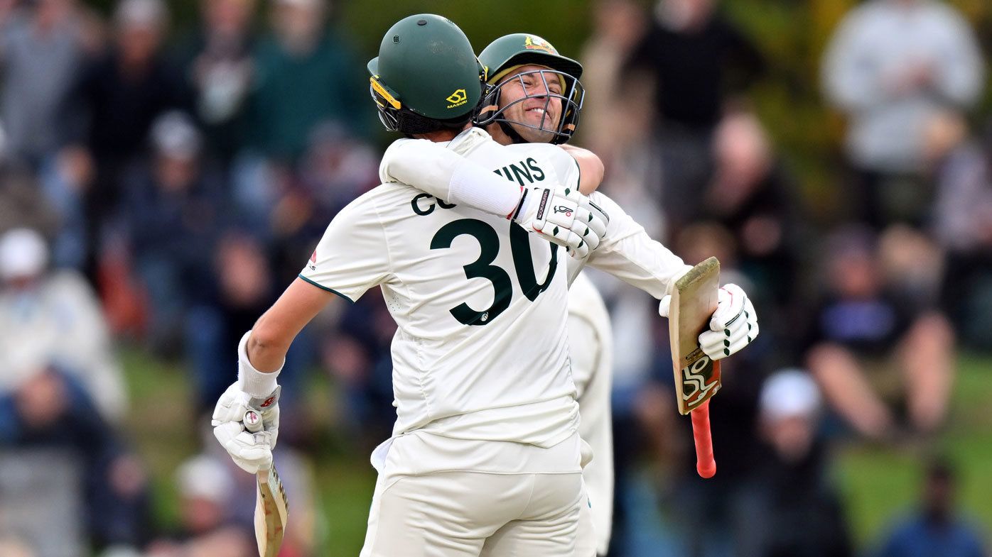 Pat Cummins and Alex Carey celebrate after knocking off the winning runs in the second Test against New Zealand.