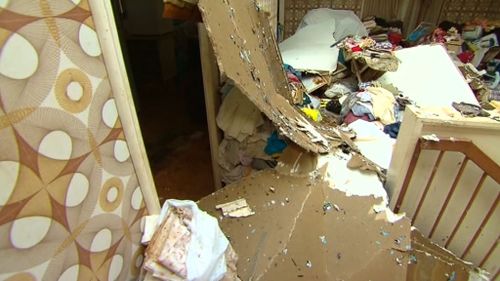 Debris littered throughout a Fernvale home. (9NEWS)