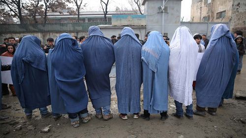 For some, the burqa in Afghanistan has become a symbol of the oppressive Taliban rule. (AAP)