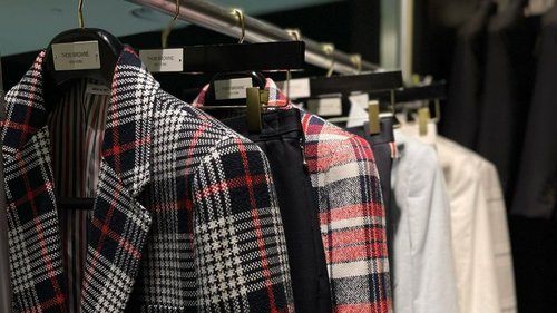 Blazers and trousers on display in a Harrolds store.