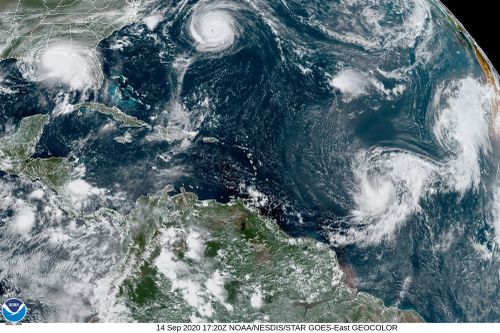 This satellite image provided by the NOAA shows five tropical cyclones churning in the Atlantic basin at 5:20 p.m. GMT on Monday, Sept. 14, 2020. The storms, from left, are Hurricane Sally over the Gulf of Mexico, Hurricane Paulette over Bermuda, the remnants of Tropical Storm Rene, and Tropical Storms Teddy and Vicky. (NOAA via AP)