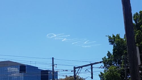 Local man Paul Chidiac captured the skywriting while driving to work. (Paul Chidiac)