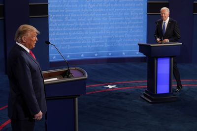 President Donald Trump and Democratic presidential candidate former Vice President Joe Biden walk on stage during the second and final presidential debate Thursday, Oct. 22, 2020, at Belmont University in Nashville, Tenn. (AP Photo/Morry Gash, Pool)