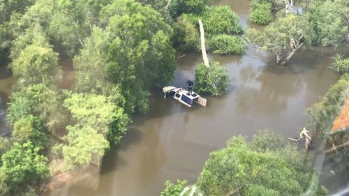NT cop rescued from roof of car after being swept away by floodwaters